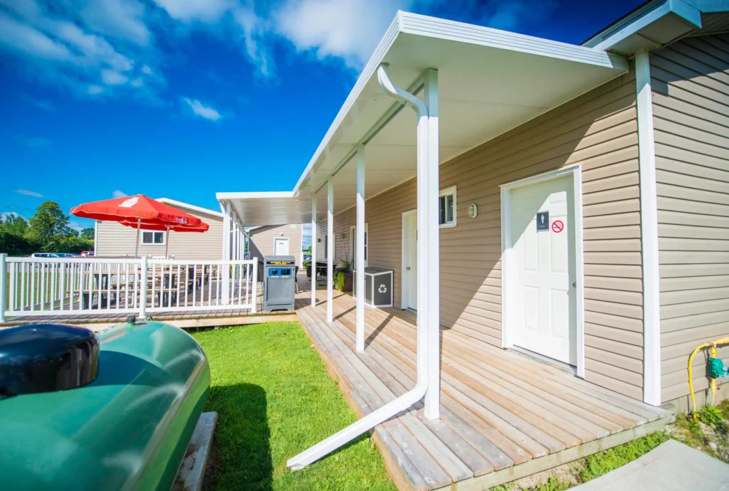 Solid Insulated Patio Covers featuring a deck with a grill and a cozy fire pit for outdoor gatherings.