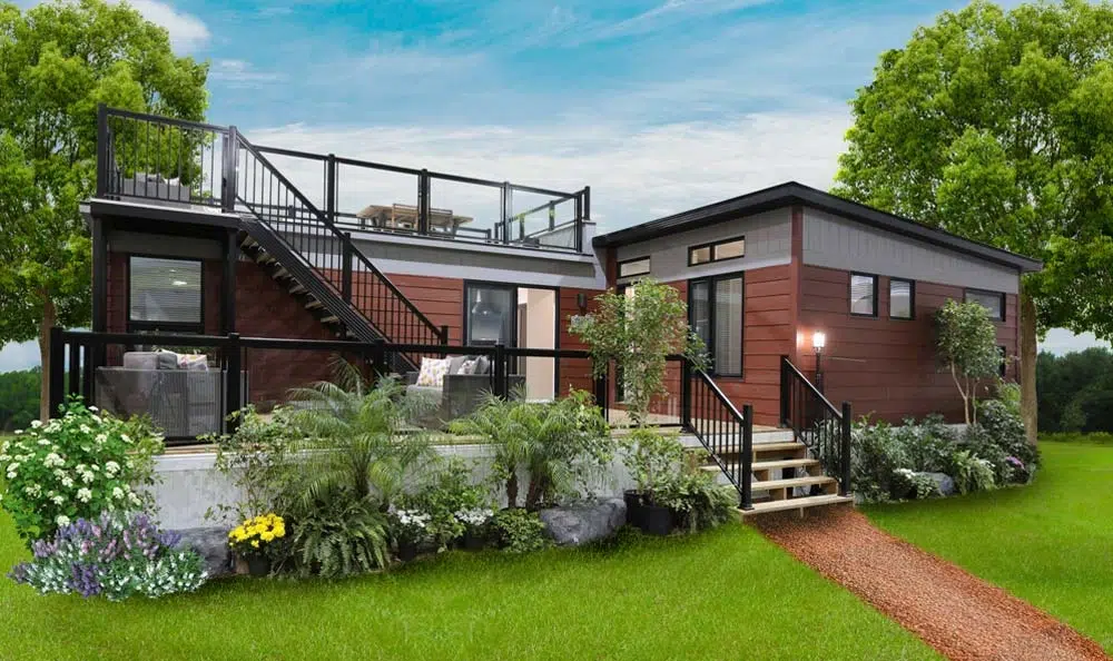 Park Model Homes of a small house featuring a deck and stairs, showcasing its compact design and outdoor space.