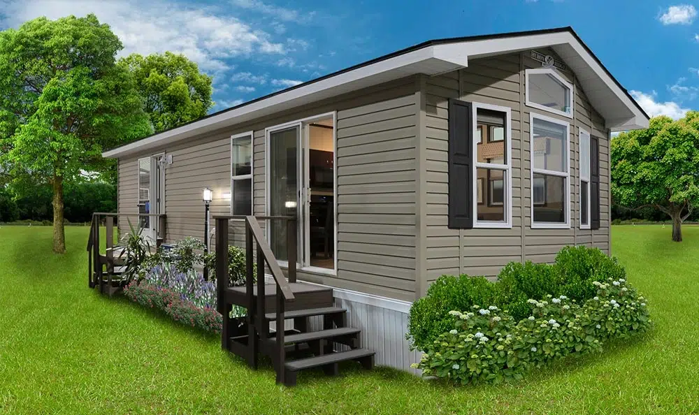 Park Model Homes of a small house featuring a deck and porch, showcasing a cozy outdoor living space.