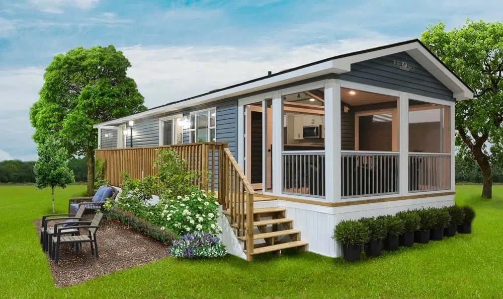 A small mobile home with a deck and patio, representing a Park Model Homes designed for compact living.