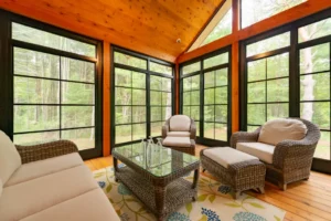 Calm Sunroom by Porch Conversions with a view of nature.