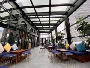 Enclosed restaurant terrace with black frames